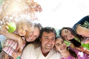 11745937-Happy-family-having-fun-in-summer-park-Stock-Photo